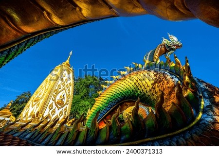 Pagoda at Phrathat Nong Bua Temple in Ubonratchatani.Thailand. showing the great nagas in front of the pagoda. the picture was taken in December 7, 2023.