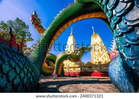 Pagoda at Phrathat Nong Bua Temple in Ubonratchatani.Thailand. showing the great nagas in front of the pagoda. the picture was taken in December 7, 2023.