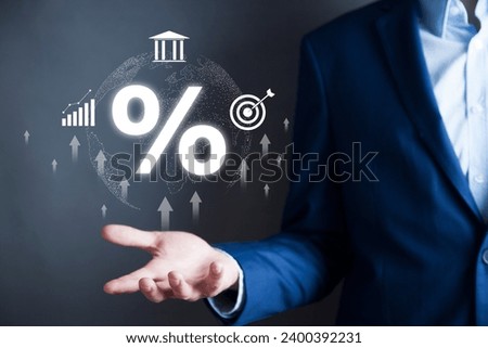Businessman touching percent symbol with arrows 