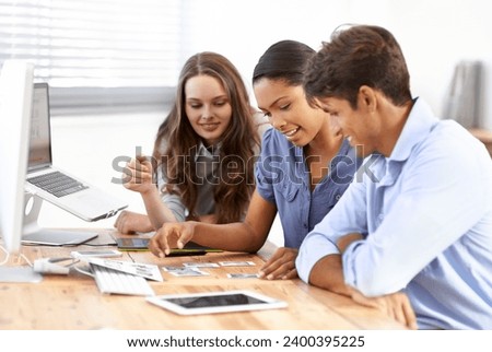 Teamwork, startup or editors planning with photograph in meeting for brainstorming together in office. Collaboration, designers talking or employees speaking of editing with pictures in workplace