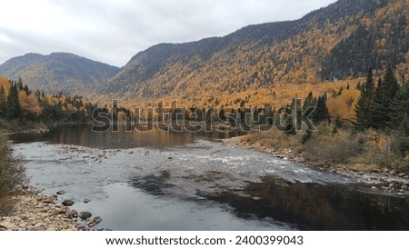Fall picture with river and trees changing color