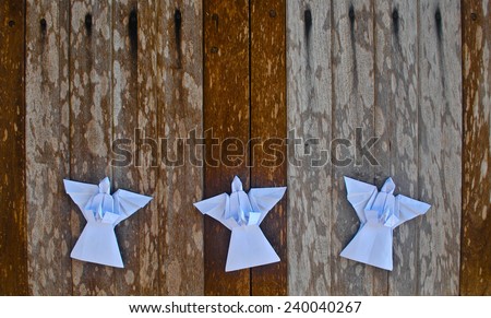 Merry Christmas card with Angels and decorations in origami style