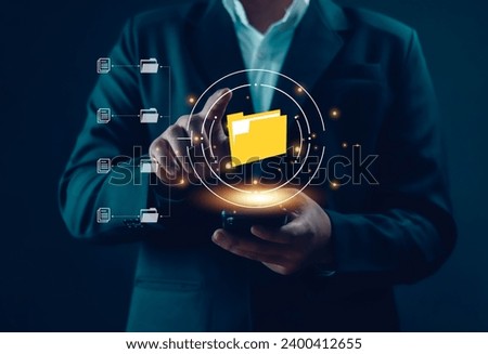 Businessman working on a laptop computer document, manage, file, data, folder, share, digital, information, Electronic document management online document database paperless office concept
