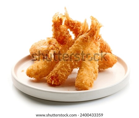 plate of breaded Torpedo shrimps isolated on white background Royalty-Free Stock Photo #2400433359