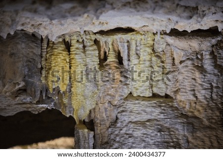 Rocks in cave coloured and contoured by running water