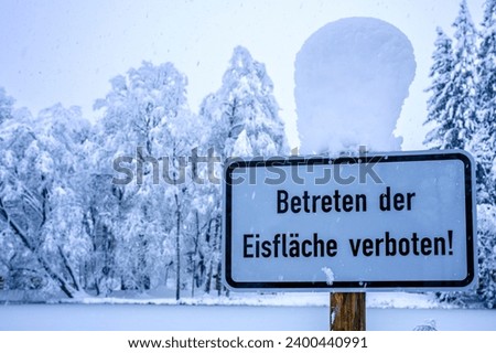 warning sign in german - translation: entering the ice surface is prohibited - photo