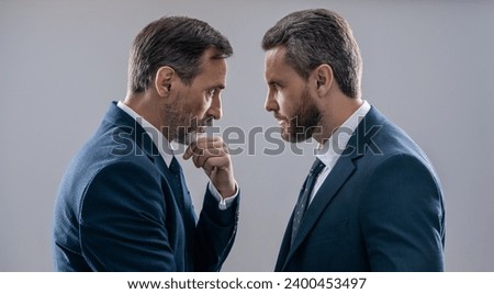 rivalry in the business world. rival strategy of businessmen isolated on grey. business competition and rivalry. rival business company. businessmen having rivalry. making serious decision Royalty-Free Stock Photo #2400453497