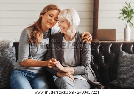 Old woman home care with social service. Caucasian female doctor caregiver caretaker nurse in hospice looking after senior lady at private clinic hospital home.