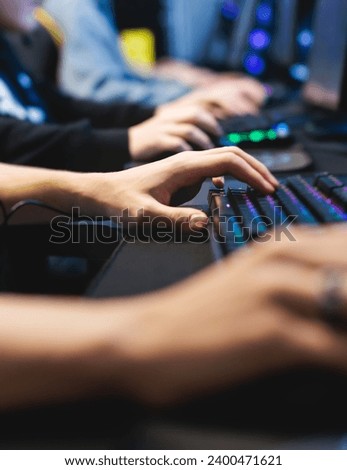 Cyber sport e-sports tournament, team of professional gamers, hands on a mouse and keyboard, gamers playing online championship in competitive moba, strategy fps game in a cyber games arena club
