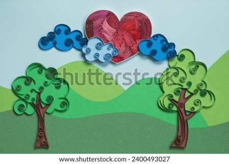 Paper heart with clouds and trees. Heart instead of the sun. Love in the air, colorful card. Hand made of paper quilling technique. copyspace.