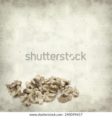 textured old paper background with walnuts