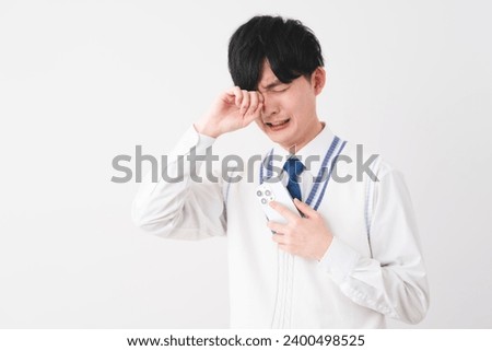 student image of young man wearing uniform Royalty-Free Stock Photo #2400498525