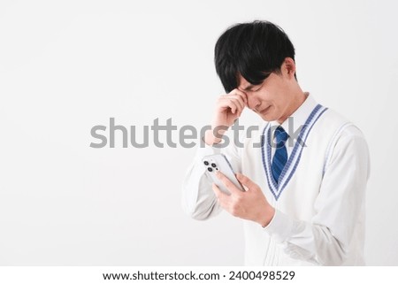 student image of young man wearing uniform Royalty-Free Stock Photo #2400498529