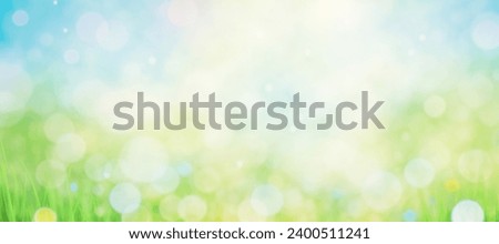 Springtime banner, blurred foilage and sky with bright bokeh. sunshine through blurred green trees, empty abstract summer or spring background banner with defocused lights and copy space Royalty-Free Stock Photo #2400511241