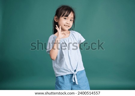 Photo of Asian baby girl on background
