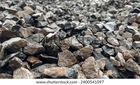 Coarse aggregate construction material in wet state, small rock background