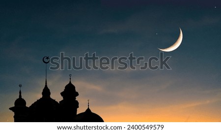 The mosque's dome is considered an architecture of hope for Muslims and is an important Islamic landmark. Background of half moon and starry sky Greeting card for the holy month of Ramadan Royalty-Free Stock Photo #2400549579