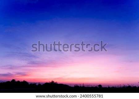 Twilight in the Evening with Orange Gold Sunset  Real amazing panoramic sunrise or sunset sky with gentle colorful clouds. Nature background  Sky back