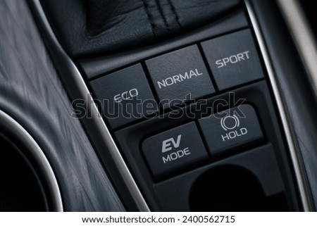 drive mode(Normal, ECO and Sport), EV mode, brake hold buttons in modern hybrid electric vehicle Royalty-Free Stock Photo #2400562715