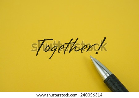 Together! note with pen on yellow background