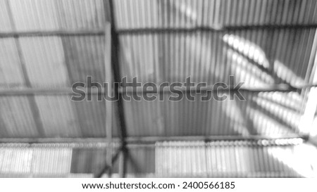 The black and white background of the wooden frame of the house and the roof of the house was photographed with an out-of-focus or blur technique