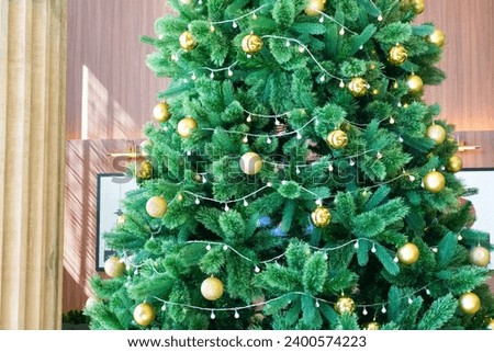 Beautiful gold Christmas ball Decorated on Christmas tree in living room,Festive image in holiday,Merry Christmas and Happy New Year.