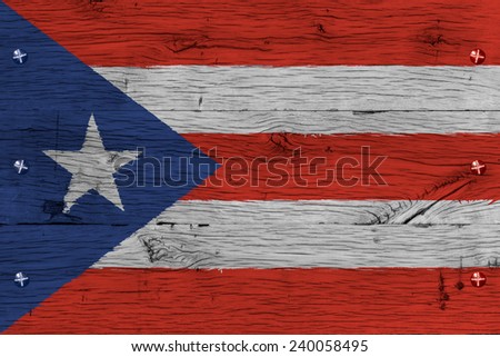 Puerto Rico national flag. Painting is colorful on wood of old train carriage. Fastened by screws or bolts.