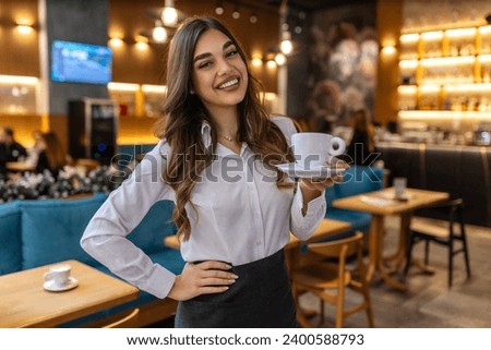One woman Caucasian waitress at cafe or restaurant carry tray with coffee female entrepreneur at work real people copy space small business concept