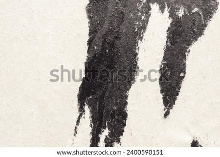 Old grunge ripped torn black paper poster surface texture background