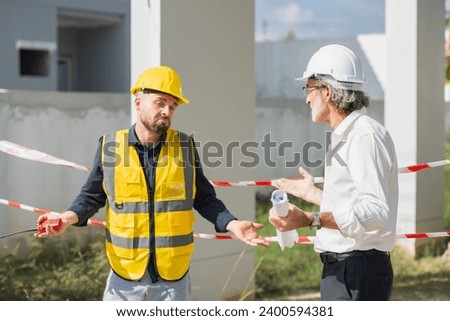 Senior officer male argue complain blame to construction engineer foreman for bad construction low quality project fail not pass standard problems Royalty-Free Stock Photo #2400594381