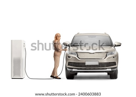 Woman charging an electric SUV at a charging point isolated on white background