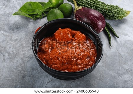 Indian cuisine - butter chicken with sauce and spices Royalty-Free Stock Photo #2400605943
