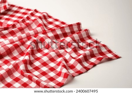 Checkered picnic blanket, red and white for background Royalty-Free Stock Photo #2400607495