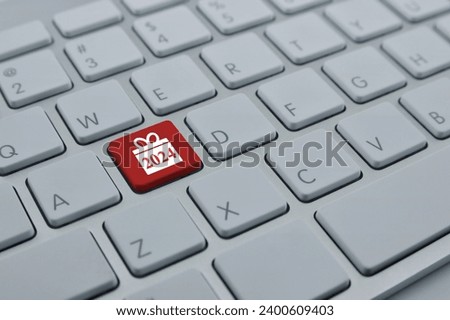 Gift box happy new year 2024 flat icon on modern computer keyboard button, Business shopping online concept