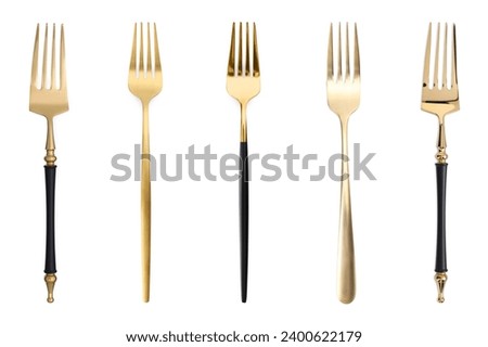 Shiny golden forks isolated on white, set Royalty-Free Stock Photo #2400622179