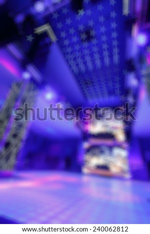 Bokeh background color disco. Blurred background nightclub spotlight on disco. Disco lights in the shape of a star. Blur background in the form of stars