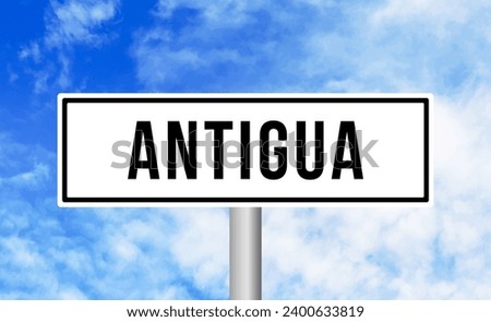 Antigua road sign on blue sky background
