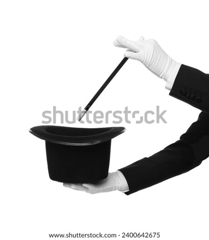 Magician showing magic trick with top hat on white background, closeup Royalty-Free Stock Photo #2400642675