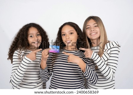 Photo portrait of multi racial group of girl friends doing purchase with pointing finger credit bank card
