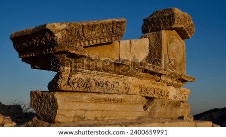 Knidos ancient city and port. Ruins of the ancient city of Knidos at sunset. Ancient buildings and sunset. Royalty-Free Stock Photo #2400659991