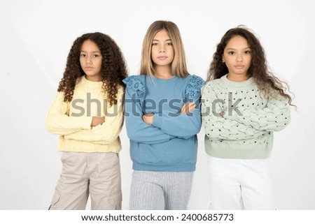 Serious pensive multi racial group of girl friends feel like cool confident entrepreneur cross hands. Royalty-Free Stock Photo #2400685773