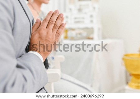 close up hands of man asian people praying in wedding ceremony traditional wallpaper background concept