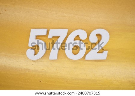 The golden yellow painted wood panel for the background, number 5762, is made from white painted wood.