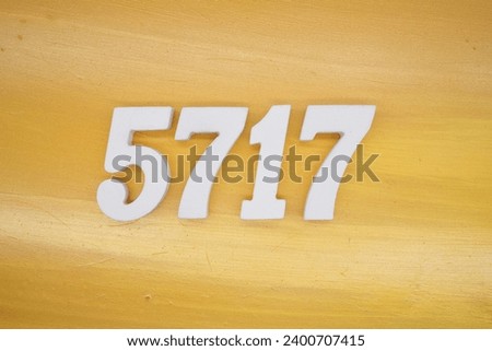 The golden yellow painted wood panel for the background, number 5717, is made from white painted wood.