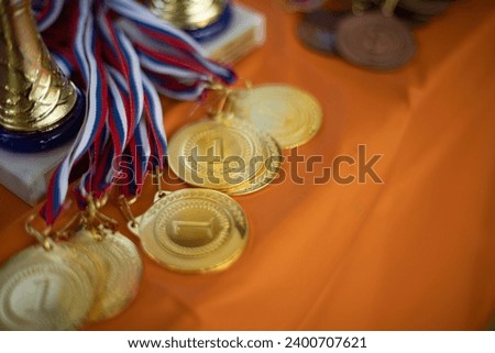 Medals at sporting event. Awards for sports in Russia. Tournament Details. Gifts to winners. Royalty-Free Stock Photo #2400707621