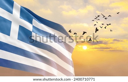 Waving flag of Greece against the background of a sunset or sunrise. Greece flag for Independence Day. The symbol of the state on wavy fabric.