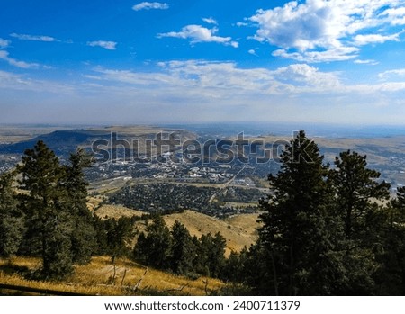 Aerial View of Golden Colorado with Denver in the Distance Between the North and South Table Mountains
