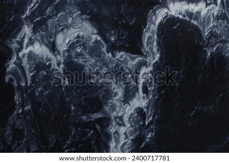 Marble blue background. Porcelain stoneware is dark blue. Texture of stone slab. Ceramic tiles for finishing floor.Graphic abstract background. Ceramic countertop.