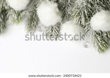 Christmas decoration green Xmas tree branches and white snow garland border on white background. Abstract Xmas ornate creative seasonal flatlay mockup