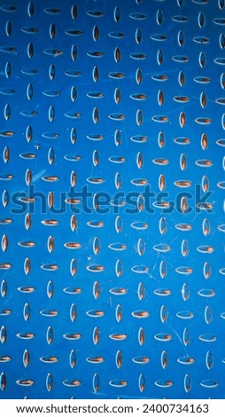 Abstract photograph with texture of stainless steel sheet, steel plate, non-slip used in industrial plants. 